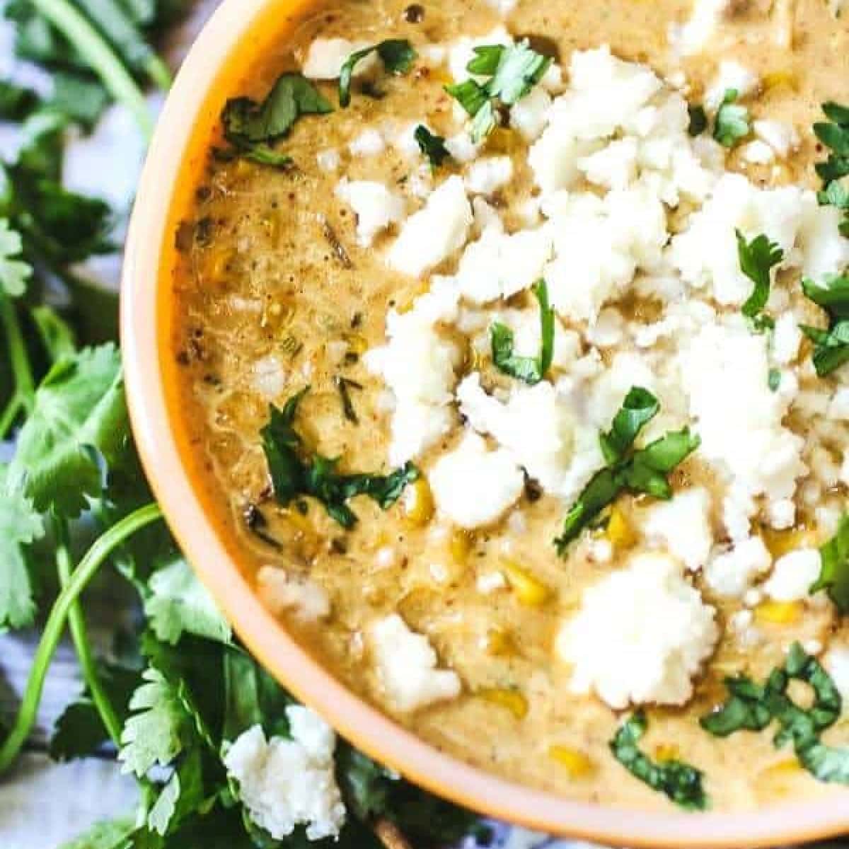 Overhead view of Mexican Street Corn soup with cheese on top.