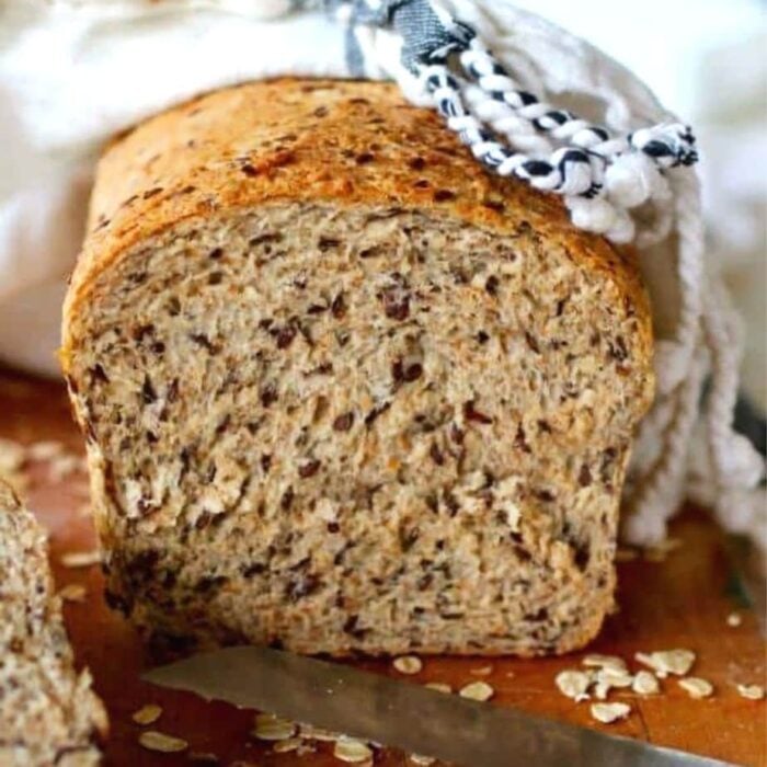 Finished loaf of homemade bread sliced to show texture.