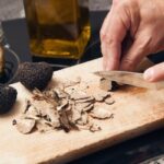 closeup of someone slicing truffles