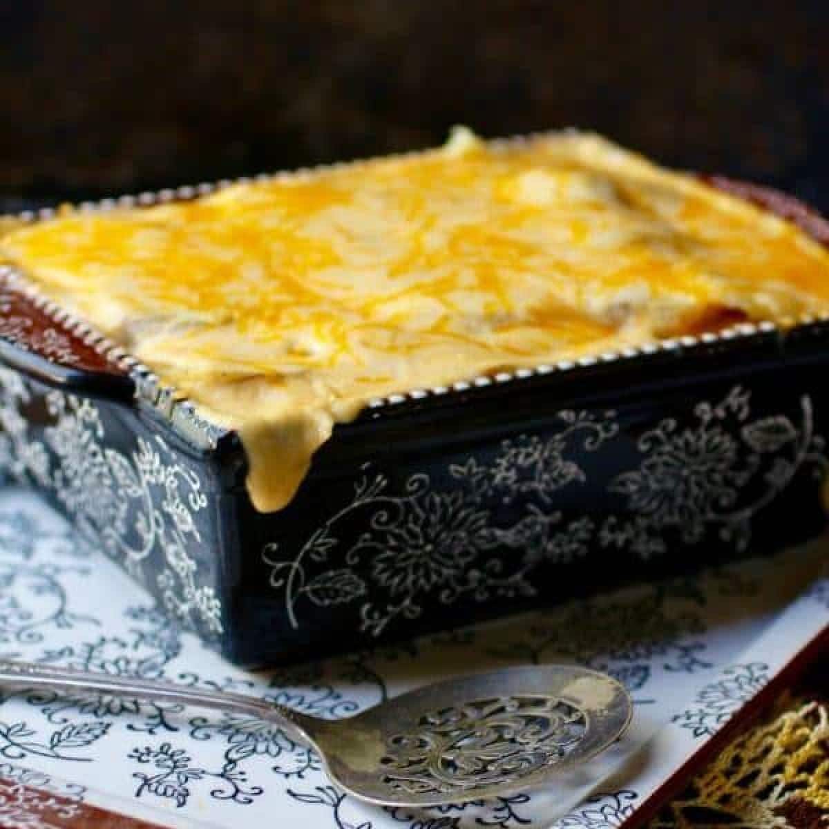 Casserole dish of. cheesy au gratin potatoes on a table.