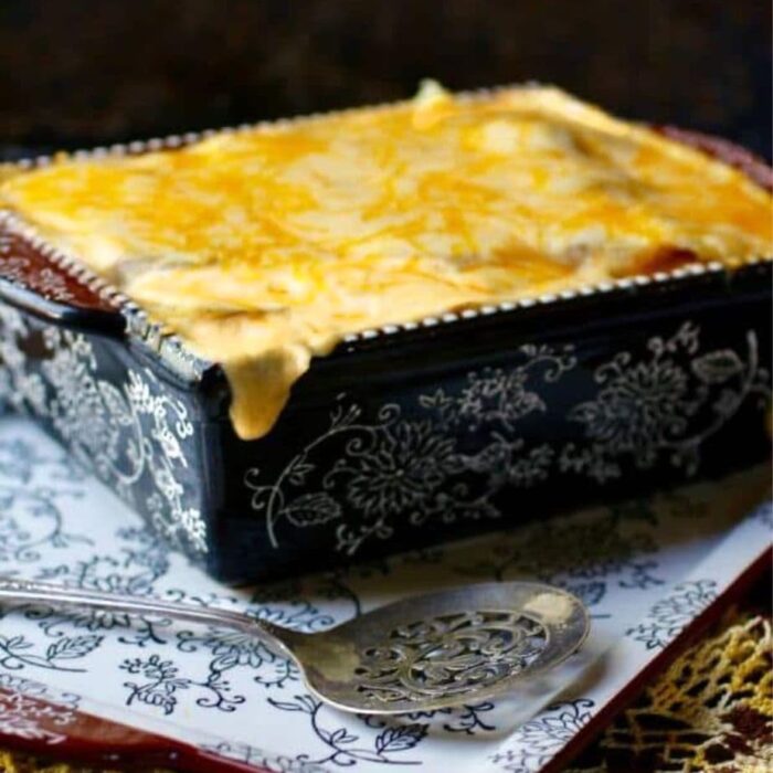 Casserole dish of. cheesy au gratin potatoes on a table.