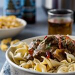 beef and beer stew from a communal table