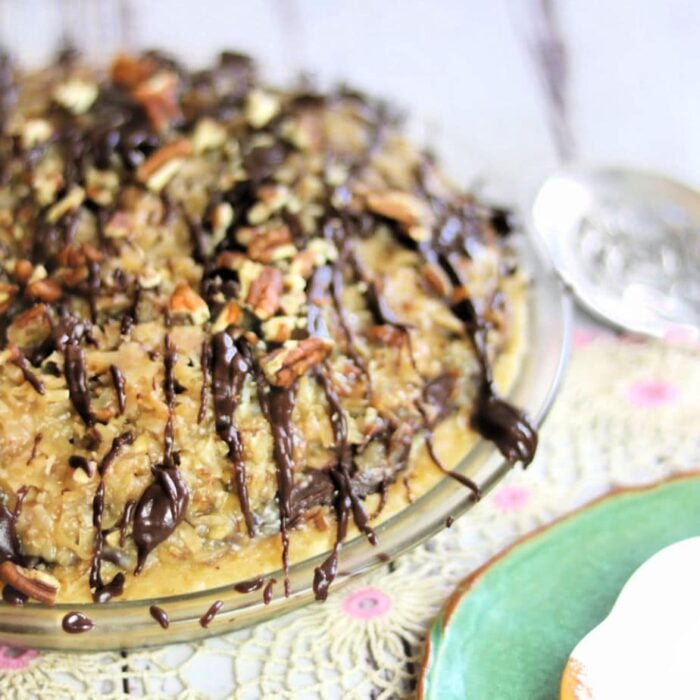 Uncut german chocolate pie showing the topping and garnish