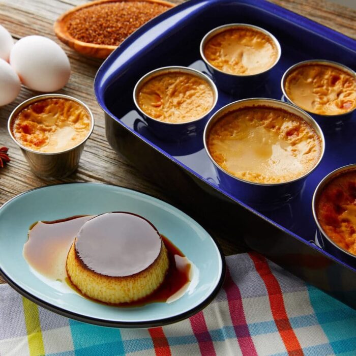 A baking pan with water in it to be used as a bain marie.