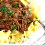 Beef and noodles on a vintage plate.