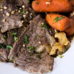 Sliced beef rump roast on a plate.