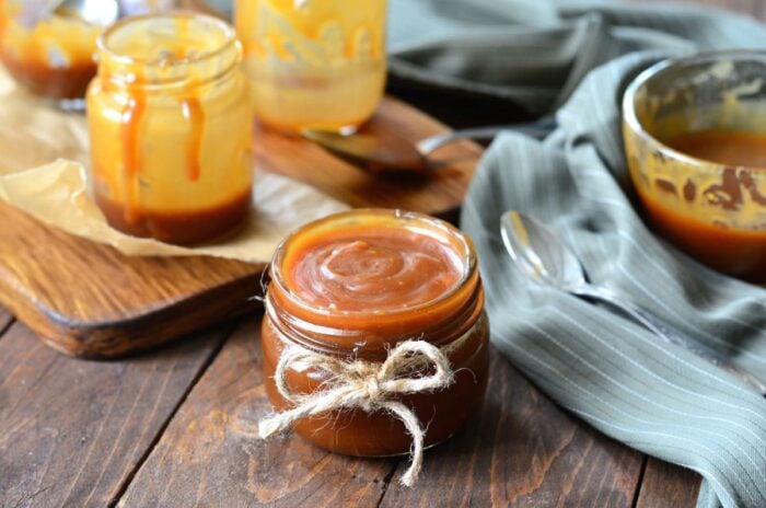 Jar of finished caramel sauce.