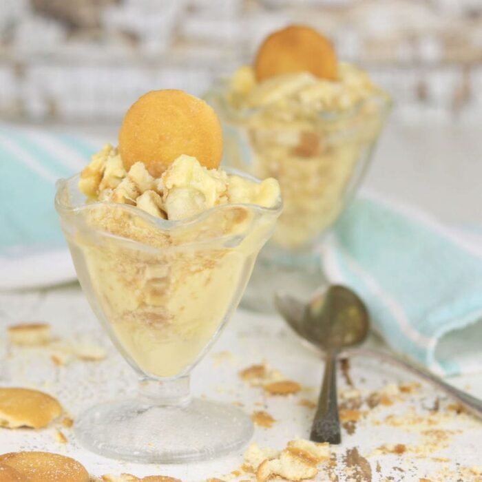 Banana pudding in serving dishes with 'Nilla Wafers on top.