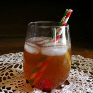 Closeup of a cocktail with two straws.