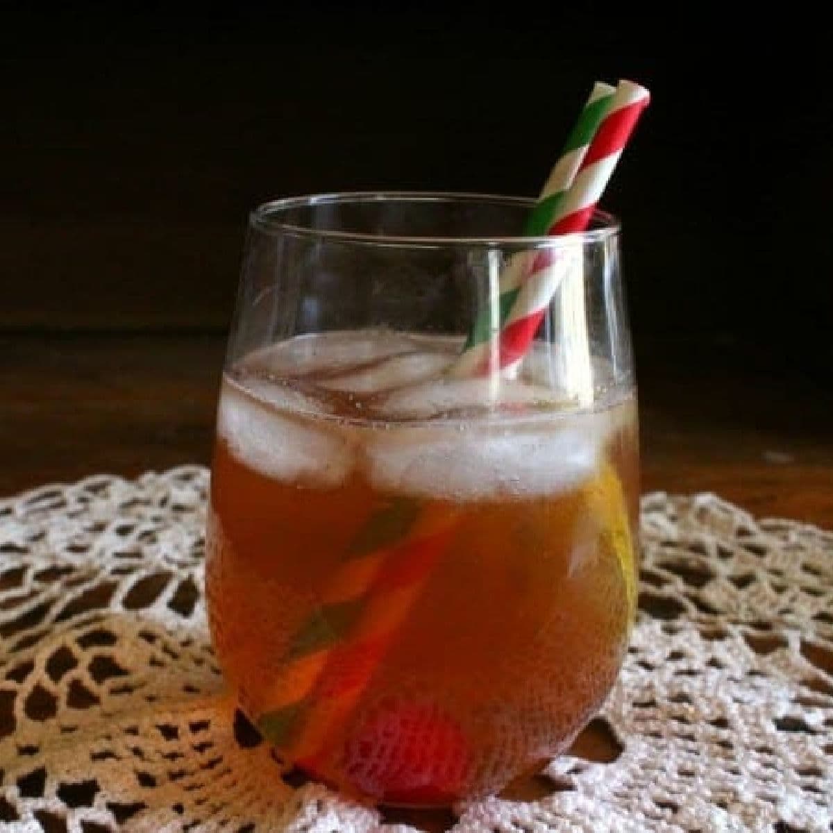 Closeup of a cocktail with two straws.