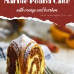 Slice of orange and bourbon marble pound cake o a plate.