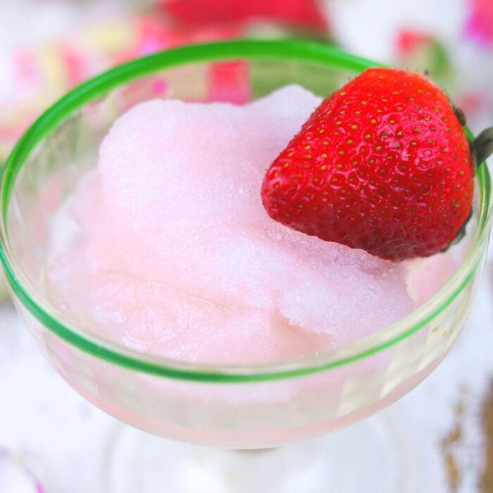 Closeup of pink rose moscato sorbet in a glass.