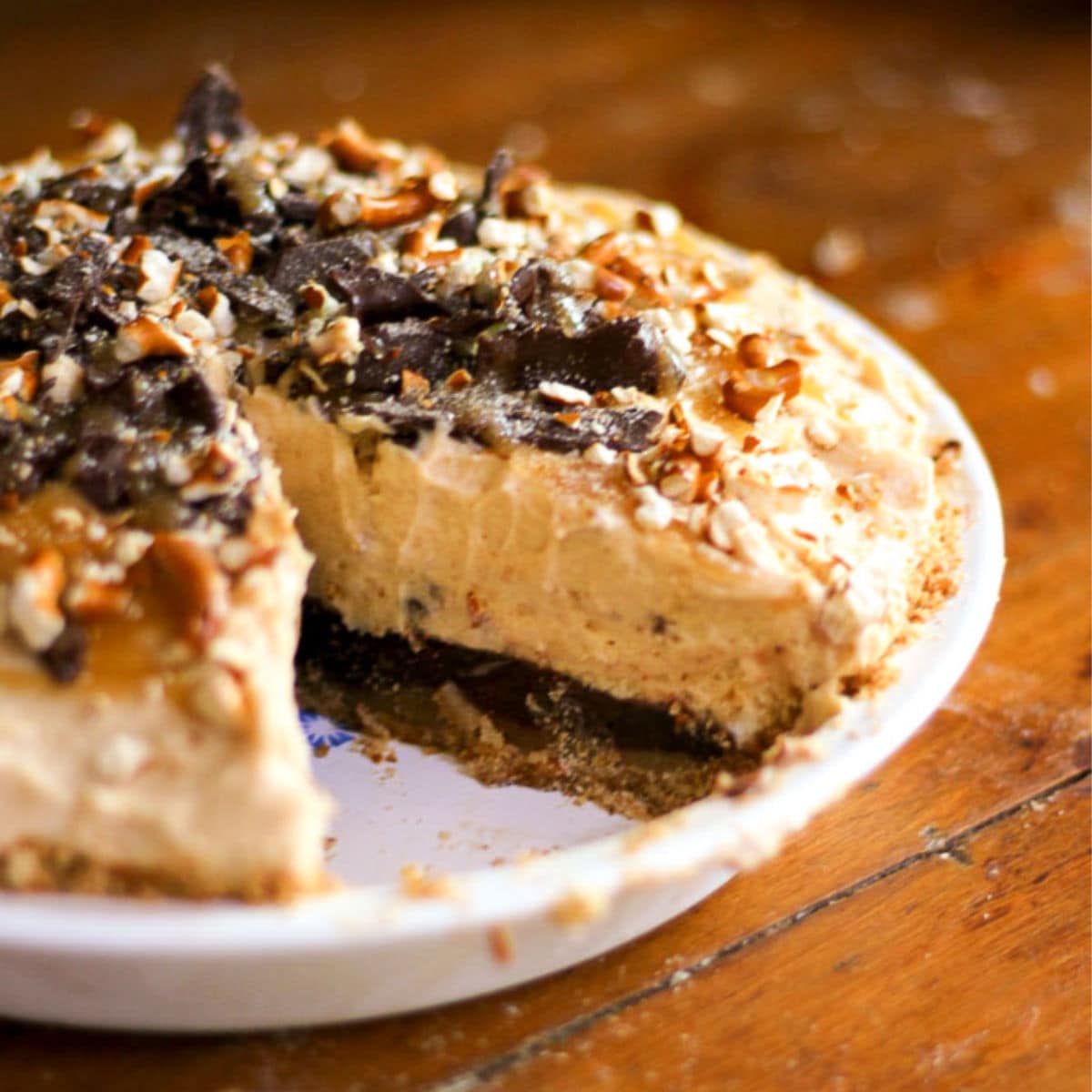 Finished pie in a white pan with a slice taken out to show texture.