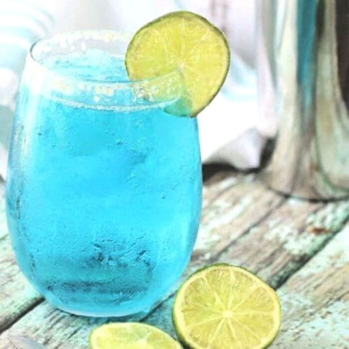 bright blue vodka cocktail in a clear glass.