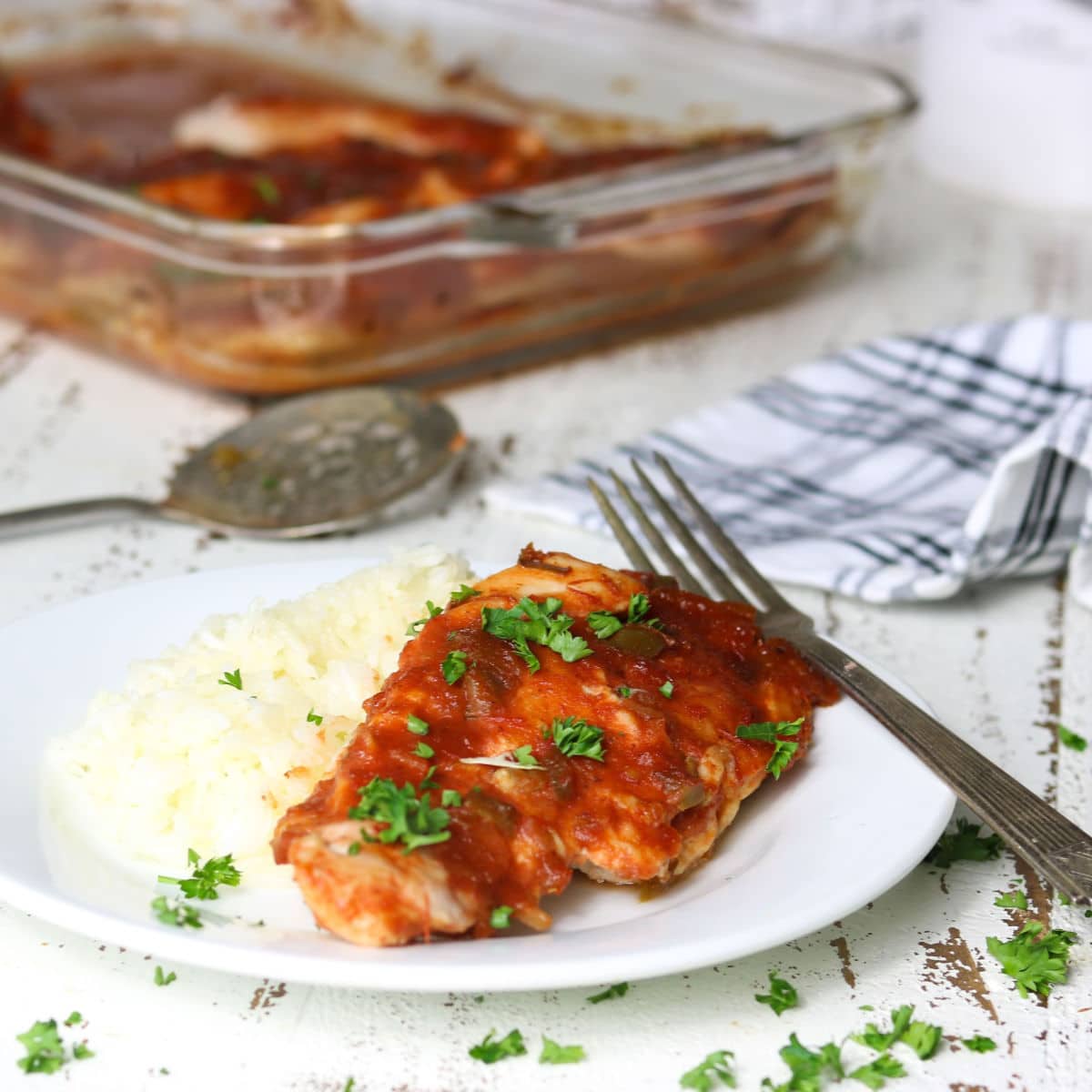 Plate of chicken and rice with a fork.