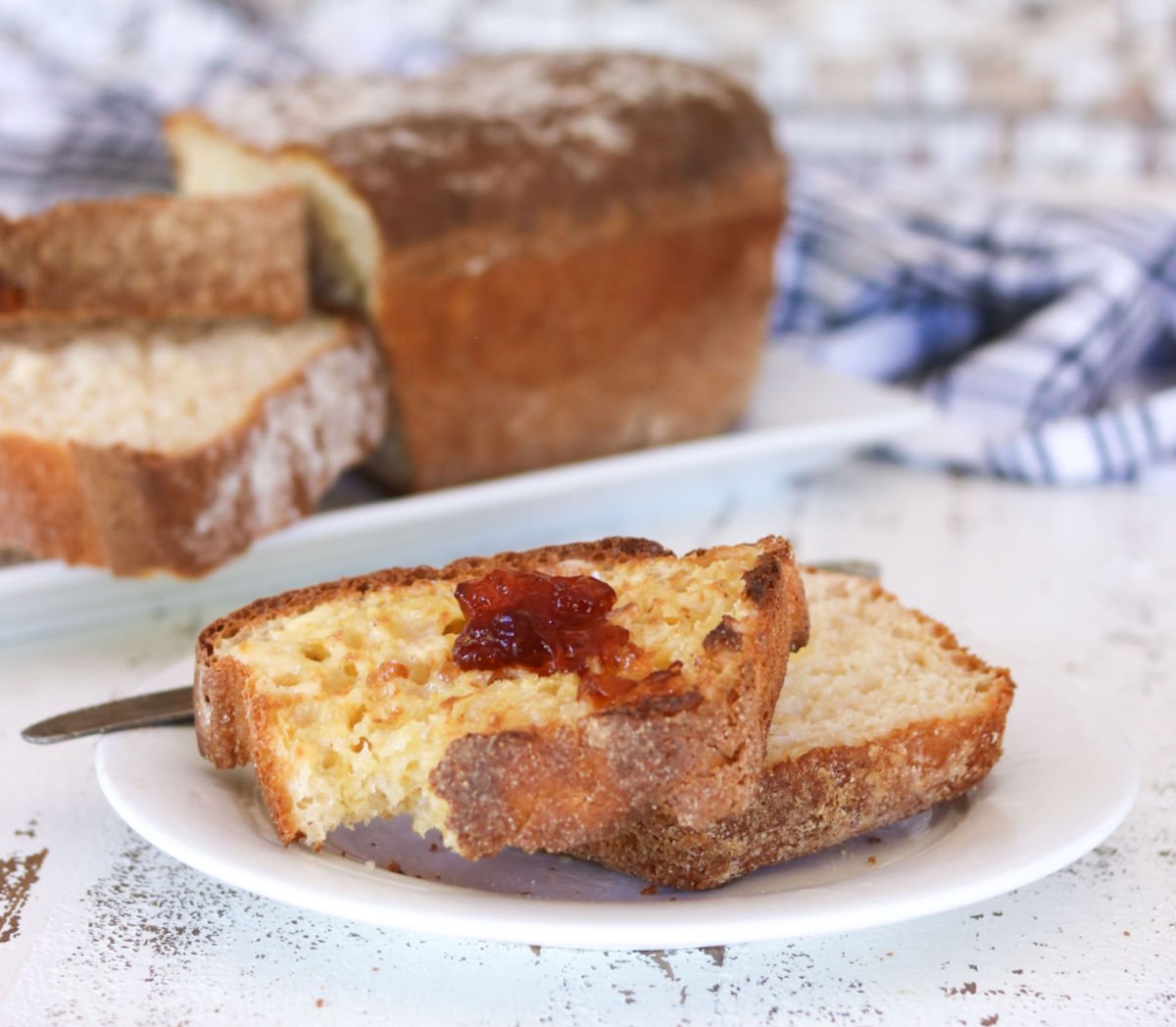 A slice of toasted english muffin bread with jam.