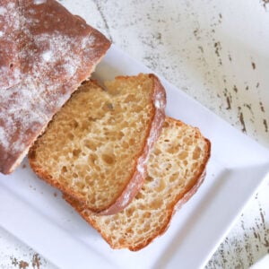 A sliced loaf of english muffin bread.