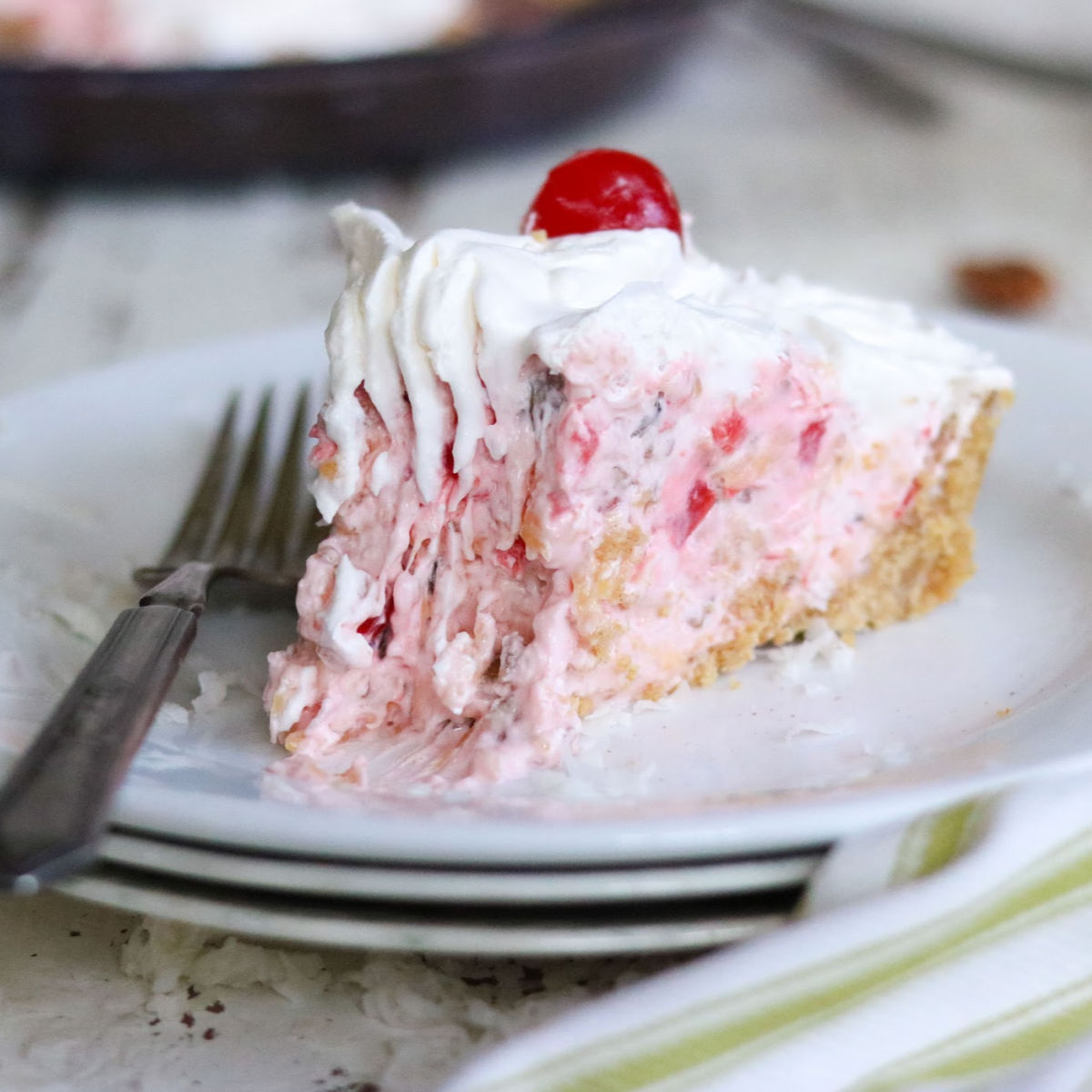 Slice of pie that is made with this crumb crust recipe.