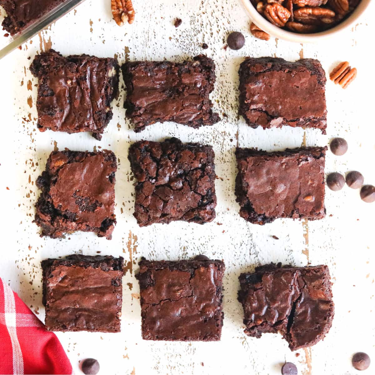 Fudgy brownies cut and arranged on a table.