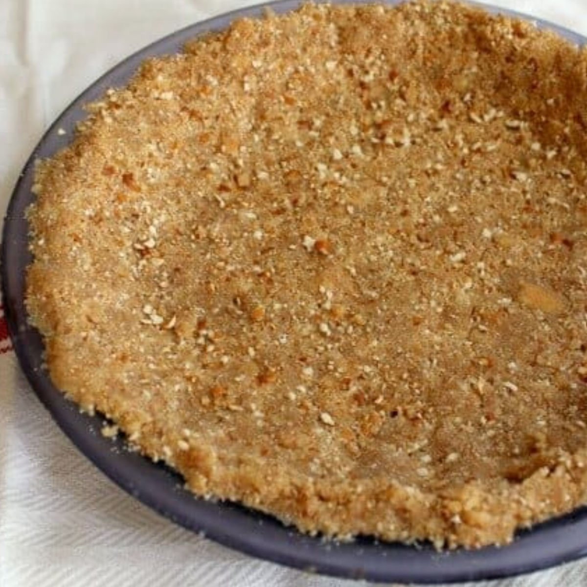 finished crumb crust in a pie plate.