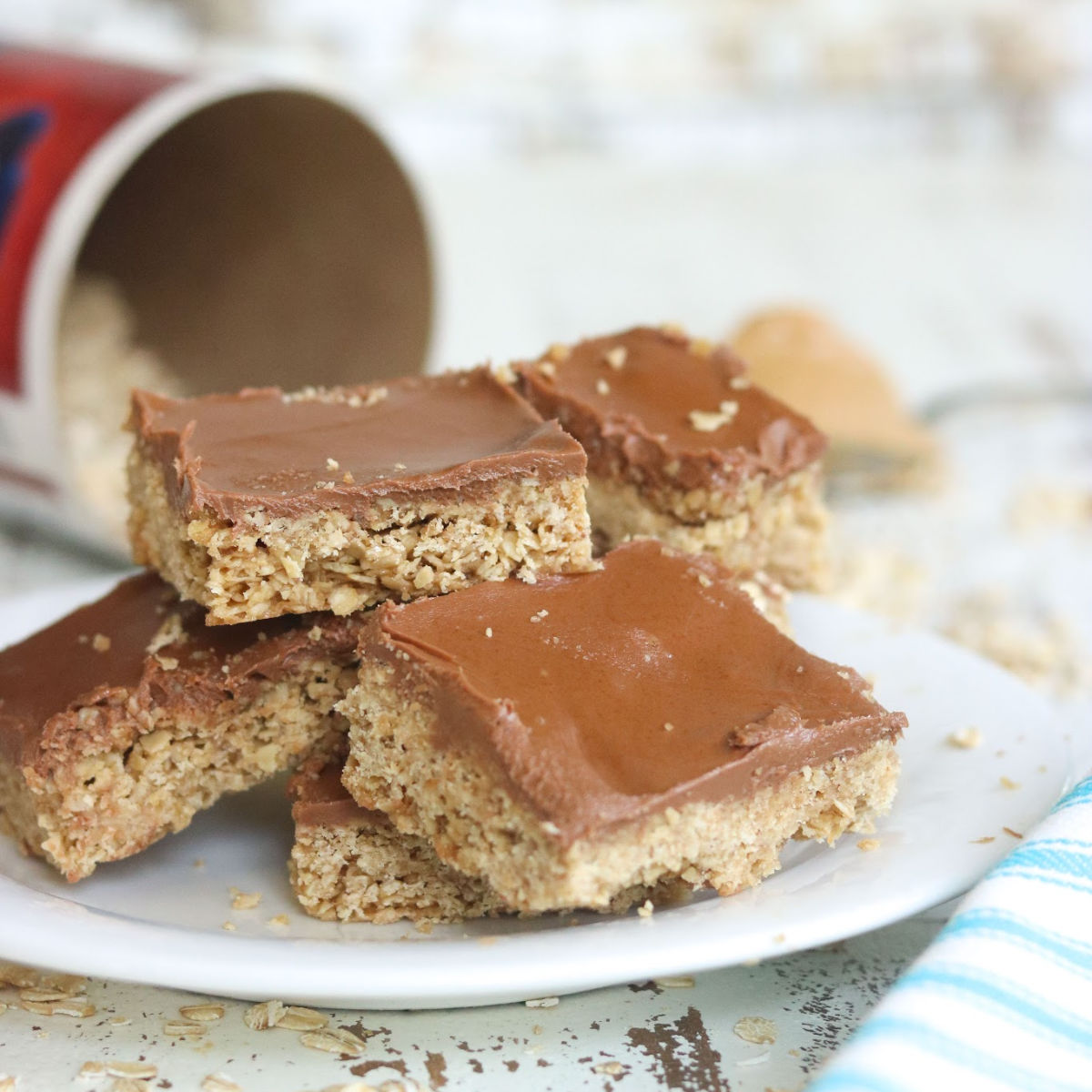 Stack of oatmeal bar cookies with chocolate frosting.