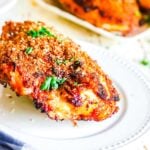 Crispy baked chicken on a white plate.