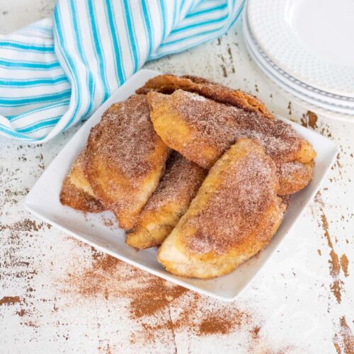 Hand pies covered in cinnamon sugar.