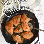 7 cooked chicken breasts with crumb topping in a pan. Text overlay for Pinterest.