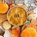 Pumpkin dip in a bowl with cookies arranged around it. Title image.