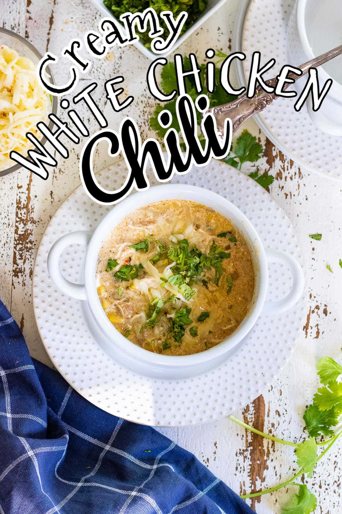 Bowl of chicken chili on a table. Title text overlay.