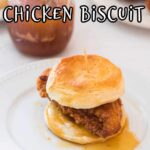 Close up of a chicken tender on a biscuit with text over lay for Pinterest.