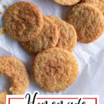 Chewy snickerdoodles on a piece of parchment paper with title text overlay for Pinterest.