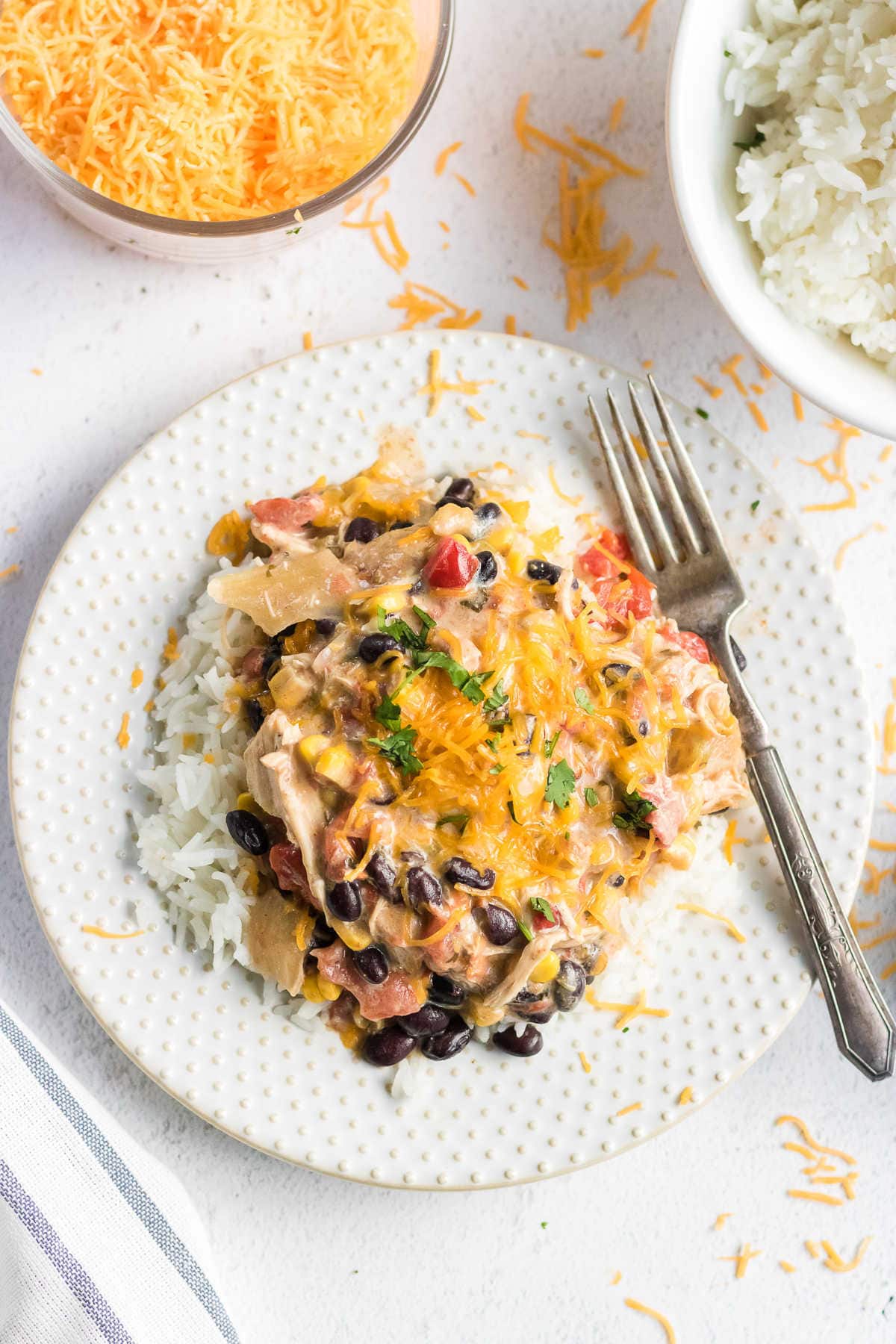 Overhead view of this recipe on a white plate. Cheese is sprinkled on top.