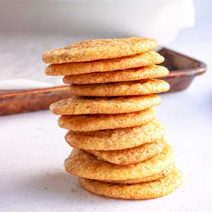 Homemade snickerdoodle cookies in a stack.