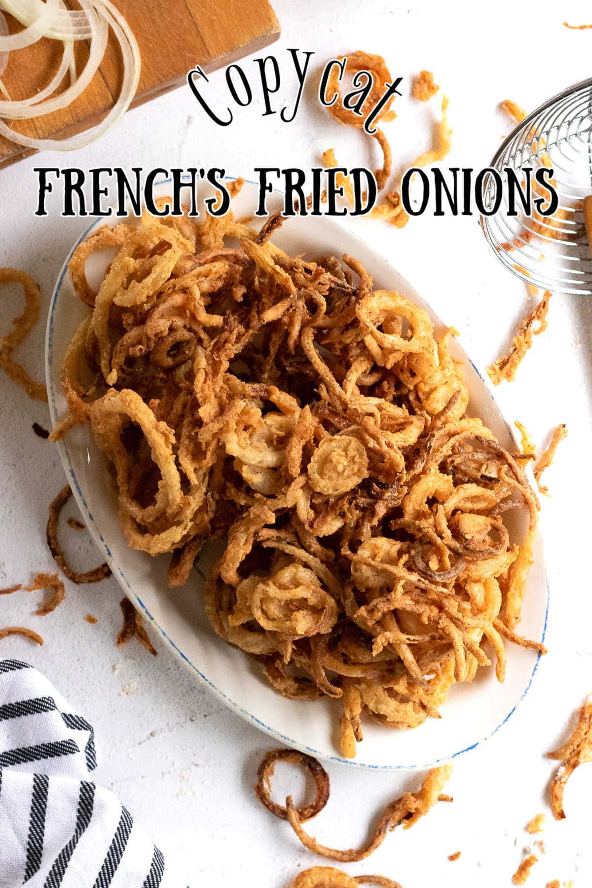 Overhead view of a platter of finished fried onions.