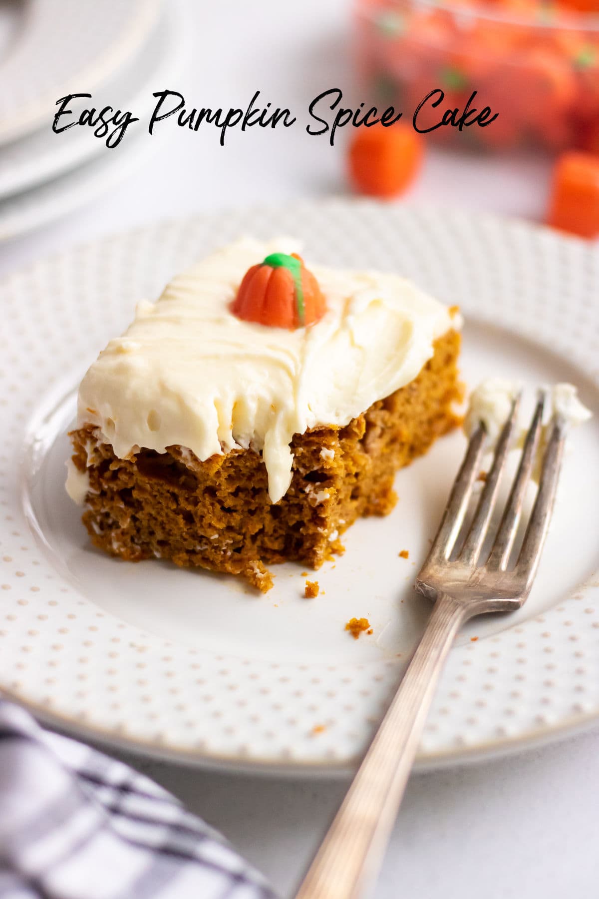 Pumpkin spice cake with a bite taken out. Title text overlay.