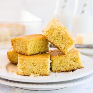 Stack of cut cornbread squares ready to be served.