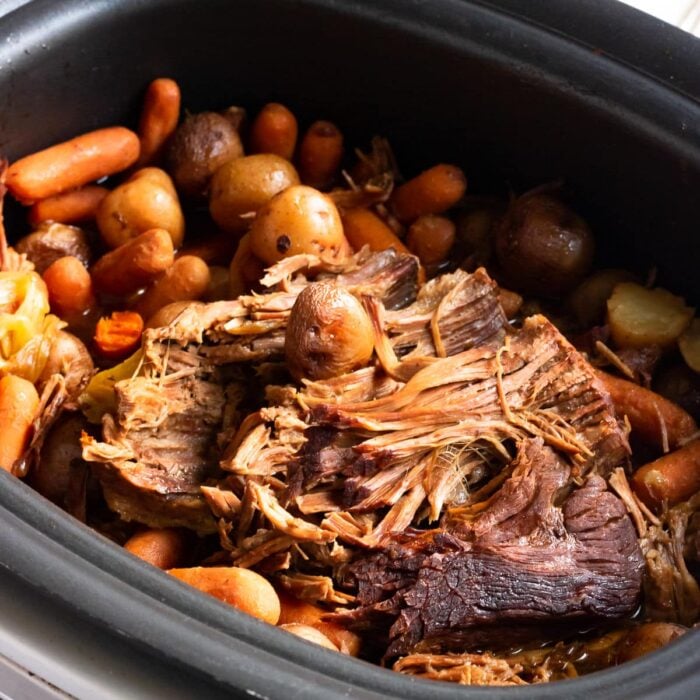 Closeup of meat and vegetables in the slow cooker.
