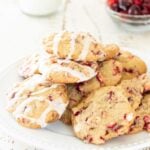 Plate stacked with cranberry cookies.