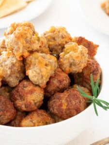 Closeup of a bowlful of cream cheese sausage balls.
