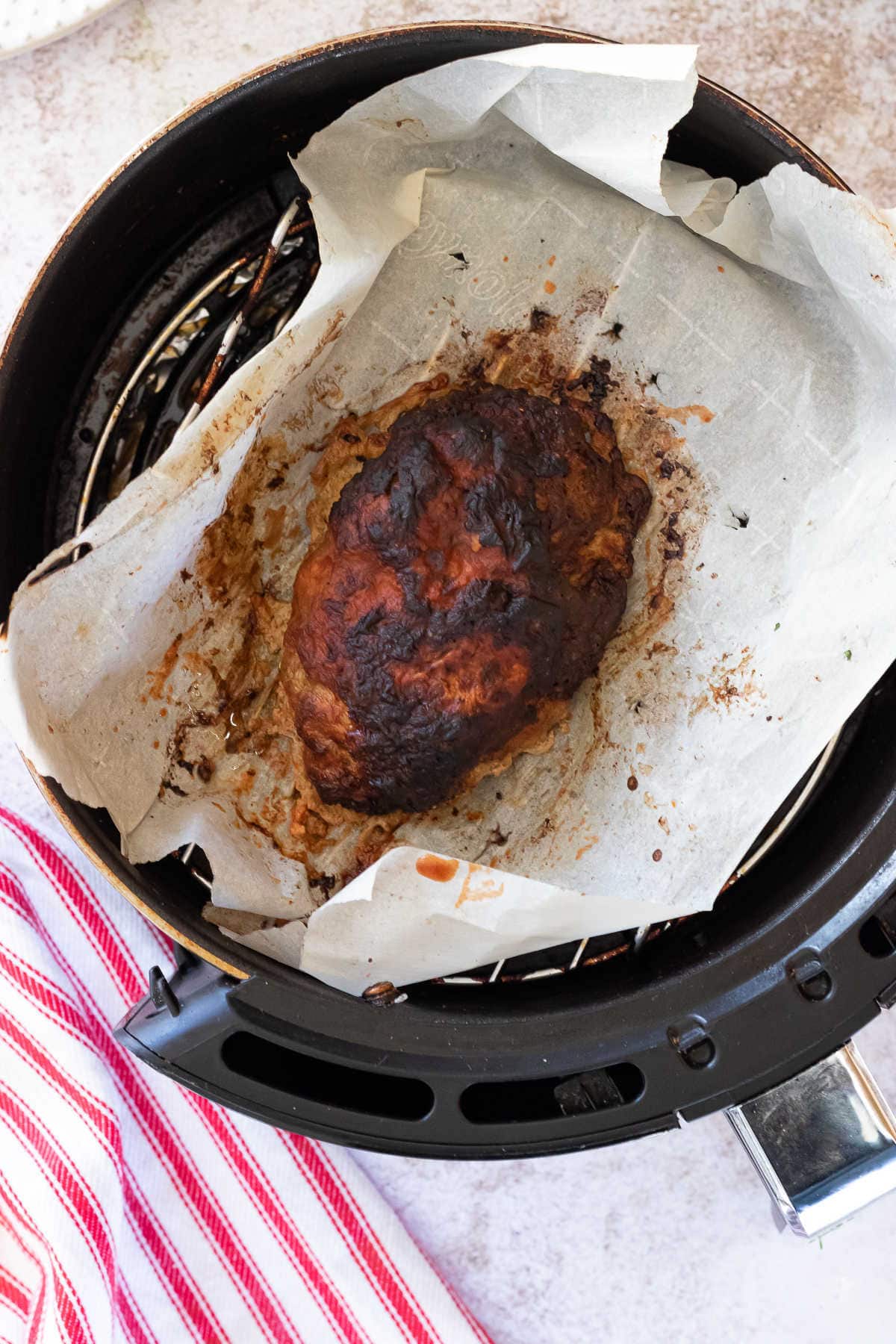 Top view of finished low carb meatloaf in an air fryer.