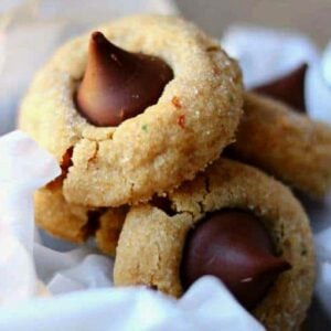 Peanut Butter Kiss Cookies on white tissue paper.