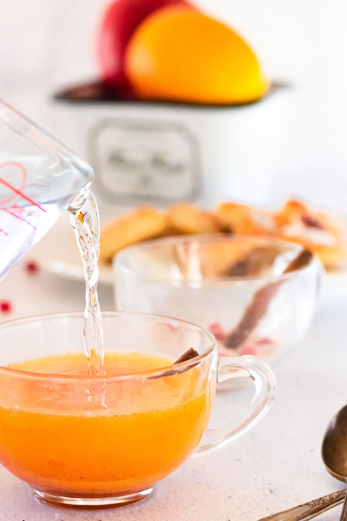 Adding water to spiced tea mix.