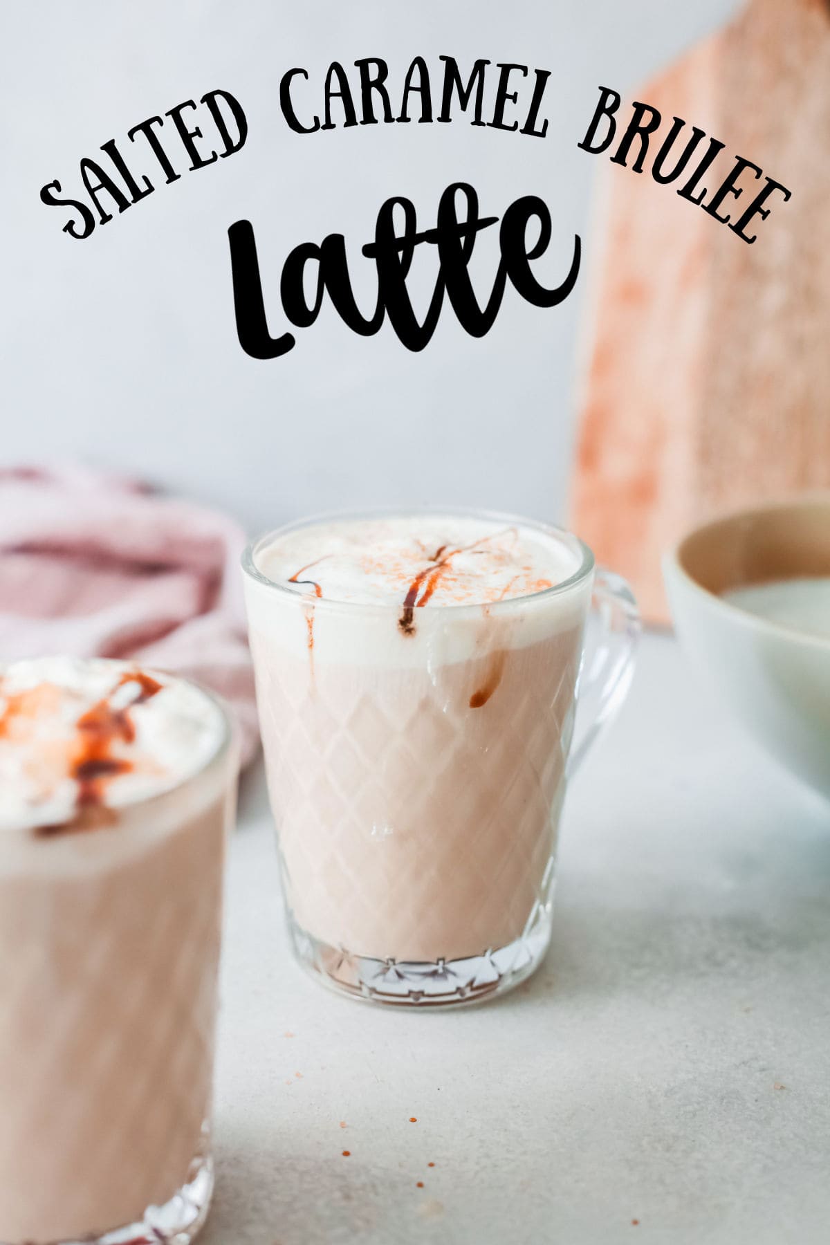 A salted caramel brulee latte in a glass coffee cup with title text overlay.