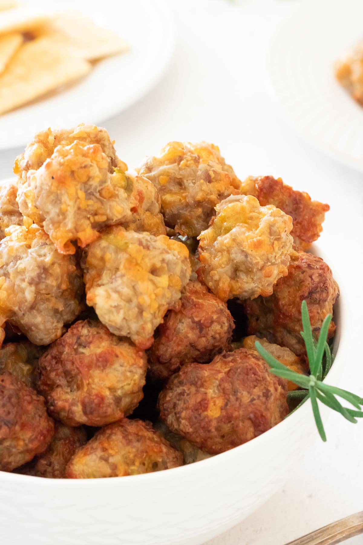 Closeup of a bowlful of cream cheese sausage balls.