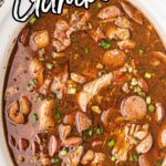 Gumbo in a slow cooker with text overlay for pinterest.