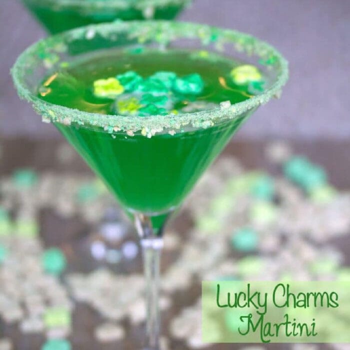 Green martini with Lucky Charms marshmallows garnish.