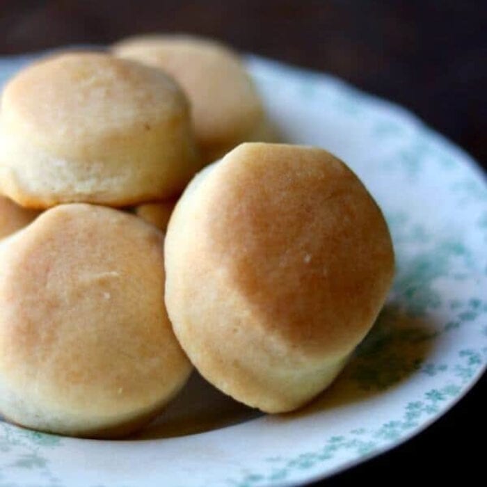 Close up of biscuits piled on a plate.