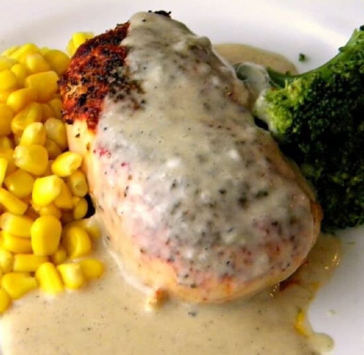 Baked chicken breast with creamy gravy.