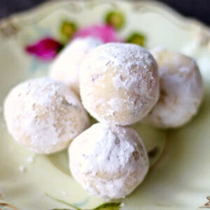 Lavender and lemon white chocolate truffles on a plate.
